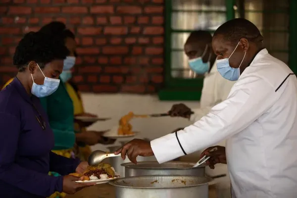Head Chef serves food to patients and staff at Butaro District Hospital