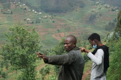 Farmers with their land in Rwanda